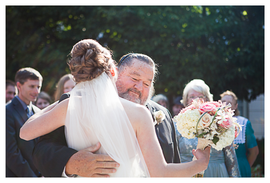 bride hugs dad at grand America wedding