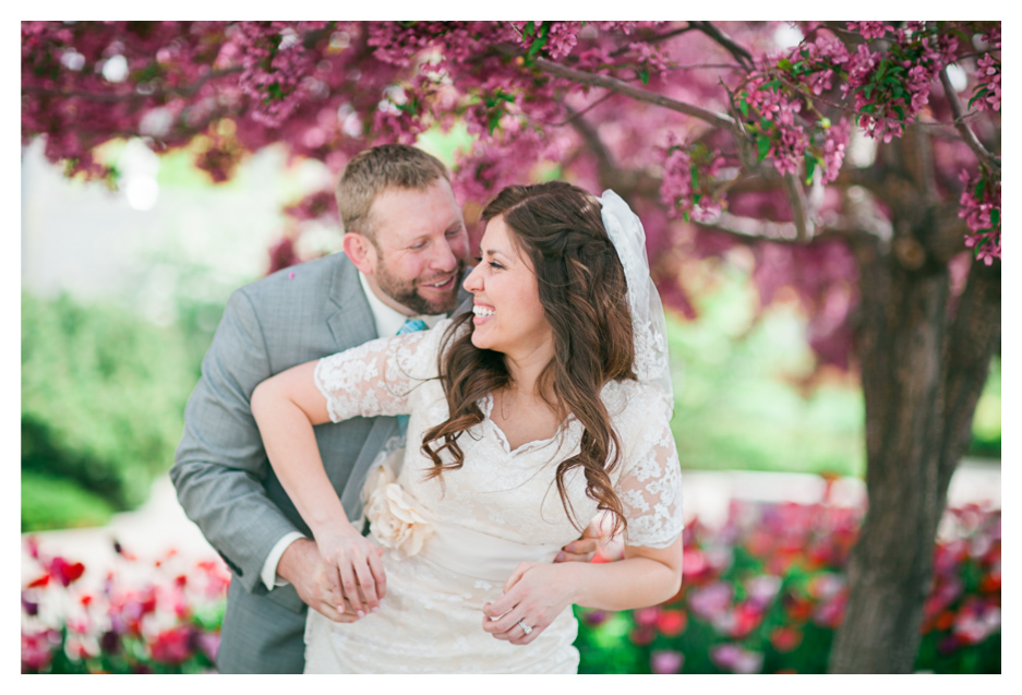 bountiful temple wedding with married couple laughing for wedding photos